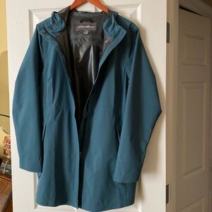 Eddie Bauer waterproof light rain jacket. Fits over mid weight layers.